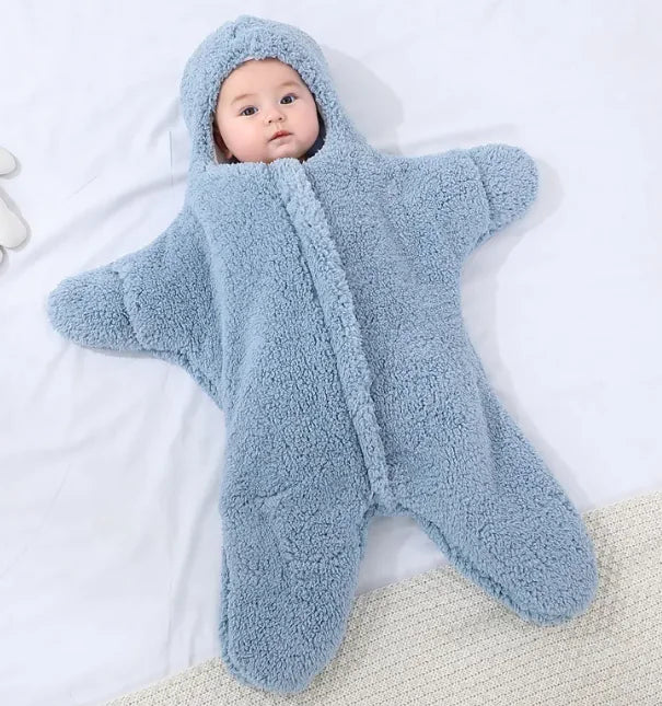 “Soft star‑shaped baby quilt with hooded, cozy fleece design, gentle on baby’s skin and perfect for nursery or crib use.”