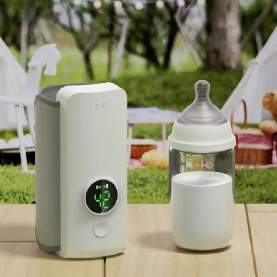 “Portable wireless baby bottle warmer with digital temperature display and adjustable heating sleeve for keeping milk warm on the go.”