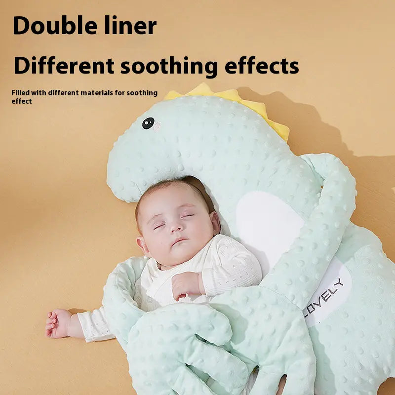 “Soft dinosaur‑shaped baby soothing pillow with plush PP‑cotton filling, designed to comfort infants ages 0–3 during rest or floor play.”