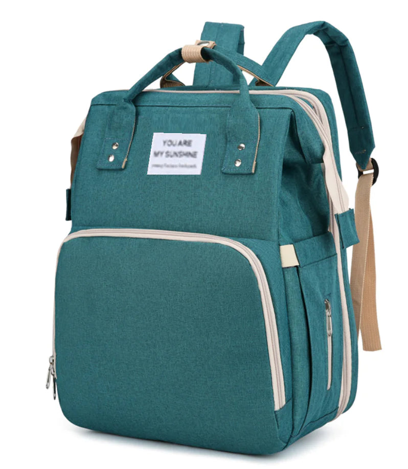 “Large‑capacity mommy backpack with front zipper pocket, dual top handles, and adjustable shoulder straps, designed for organized baby essentials and travel use.”