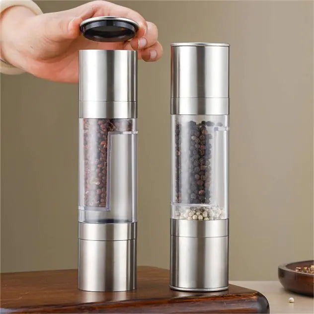 “Stainless‑steel 2‑in‑1 pepper and spice grinder with clear center chamber and dual grinding heads, sleek cylindrical design.”