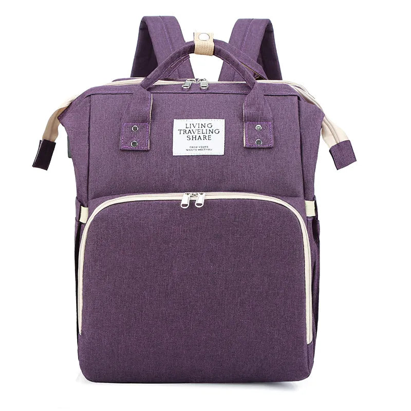 “Large‑capacity mommy backpack with front zipper pocket, dual top handles, and adjustable shoulder straps, designed for organized baby essentials and travel use.”