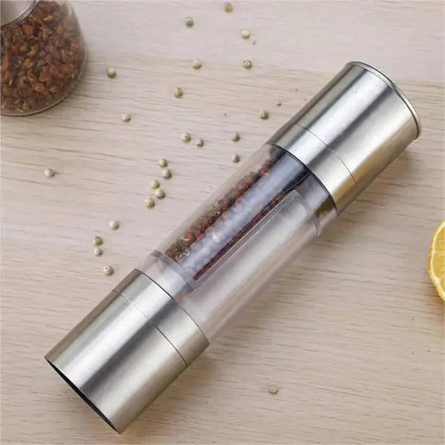 “Stainless‑steel 2‑in‑1 pepper and spice grinder with clear center chamber and dual grinding heads, sleek cylindrical design.”