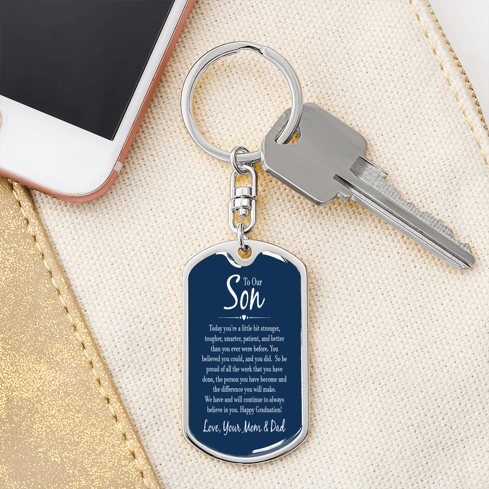 “Personalized dog tag keychain with custom photo on message card reading ‘To Our Son’ from Mom and Dad, displayed in gift box.”