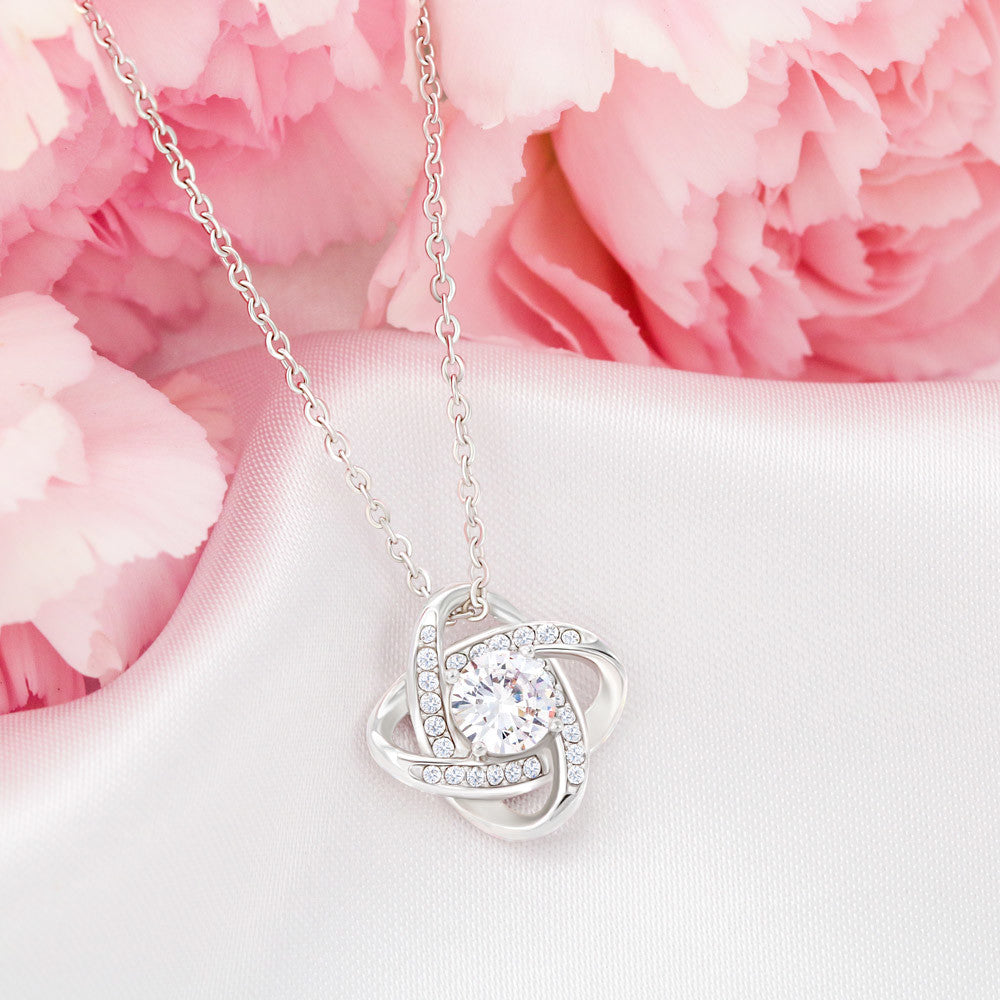“Love Knot Necklace in gift box with romantic ‘To My Wife’ message from husband, featuring silver pendant with sparkling center stone.”
