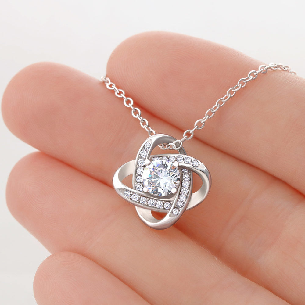 “Love Knot Necklace in gift box with romantic ‘To My Wife’ message from husband, featuring silver pendant with sparkling center stone.”