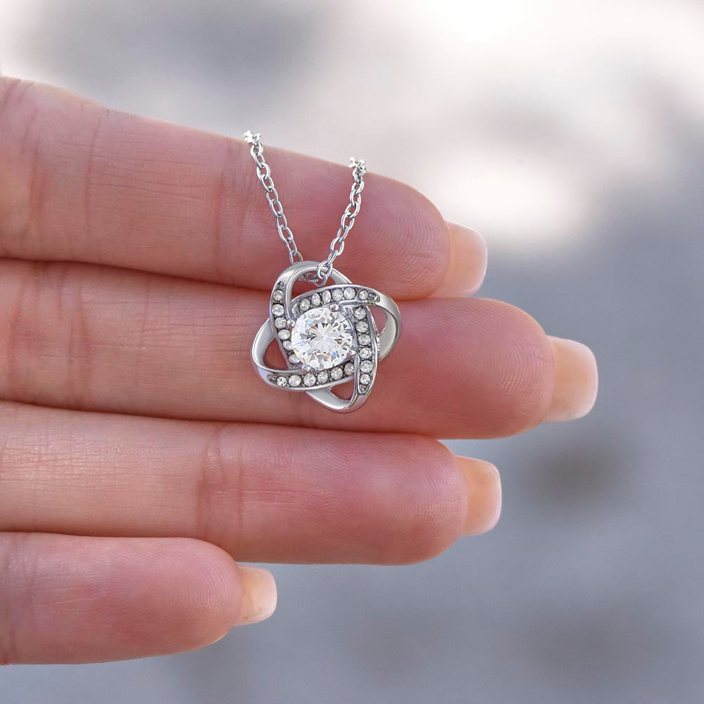 “Love Knot Necklace in gift box with romantic ‘To My Wife’ message from husband, featuring silver pendant with sparkling center stone.”