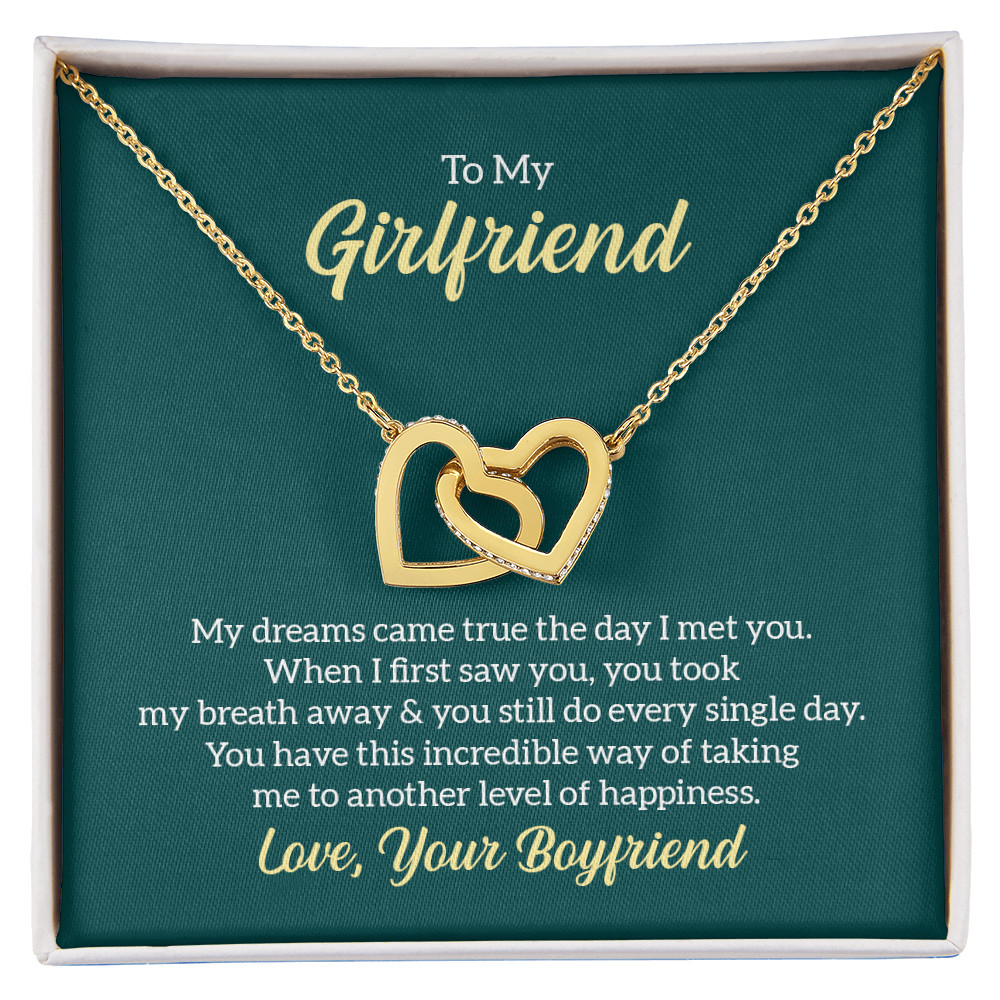 “Interlocking hearts necklace in silver and rose gold displayed in gift box with romantic ‘To My Girlfriend’ message card from boyfriend.”