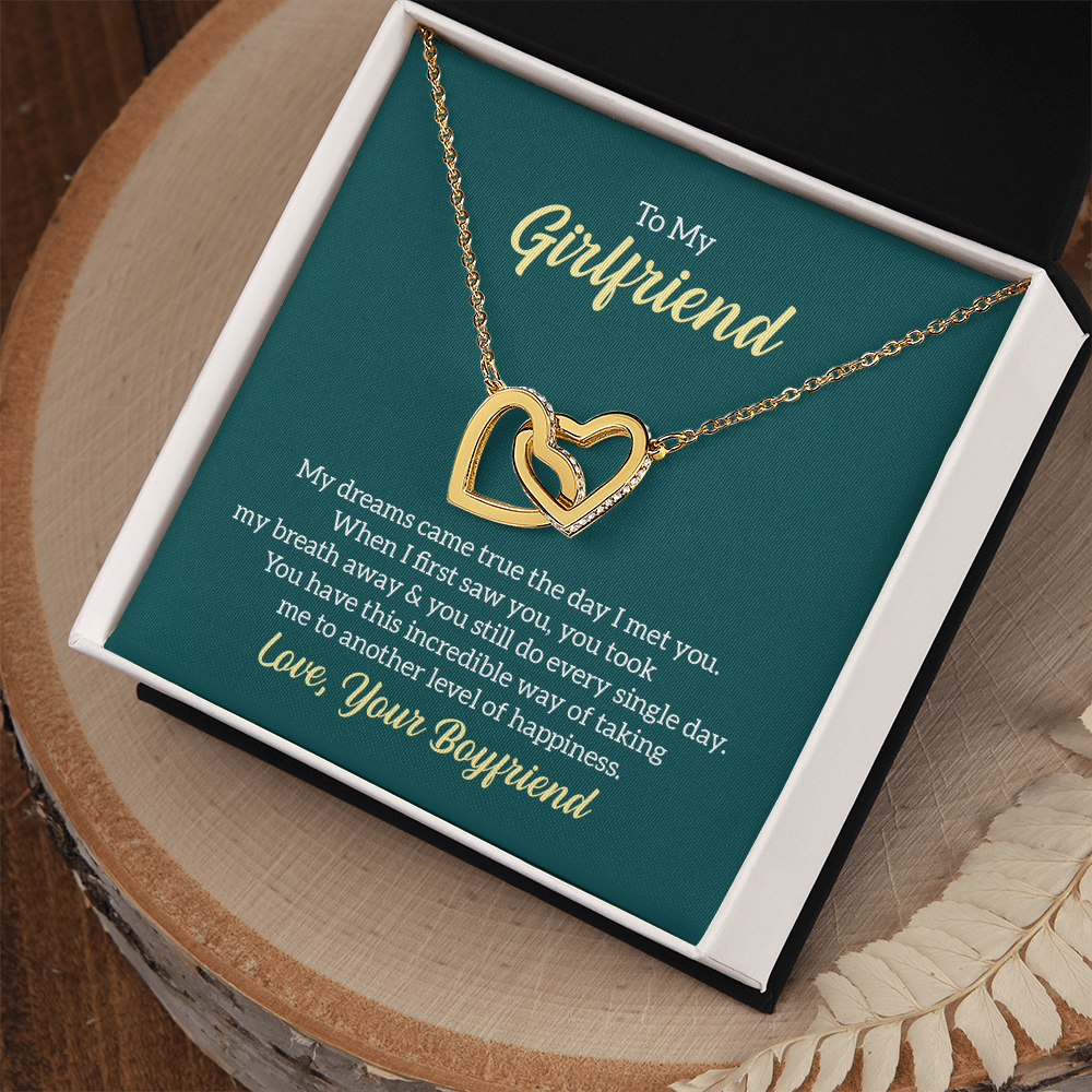 “Interlocking hearts necklace in silver and rose gold displayed in gift box with romantic ‘To My Girlfriend’ message card from boyfriend.”
