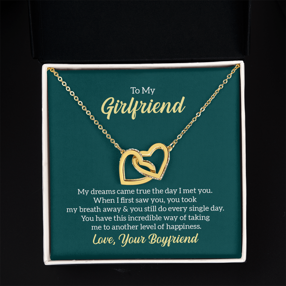 “Interlocking hearts necklace in silver and rose gold displayed in gift box with romantic ‘To My Girlfriend’ message card from boyfriend.”
