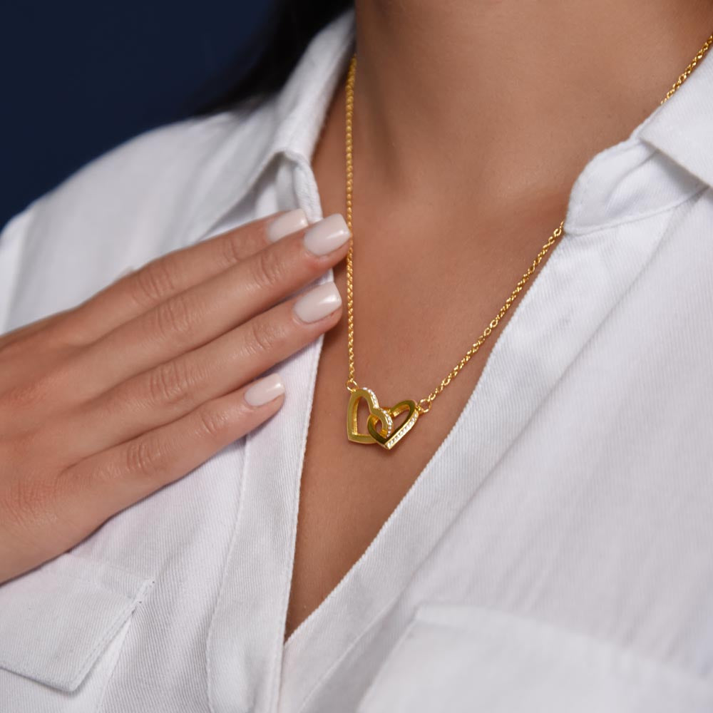 “Interlocking hearts necklace in silver and rose gold displayed in gift box with romantic ‘To My Girlfriend’ message card from boyfriend.”