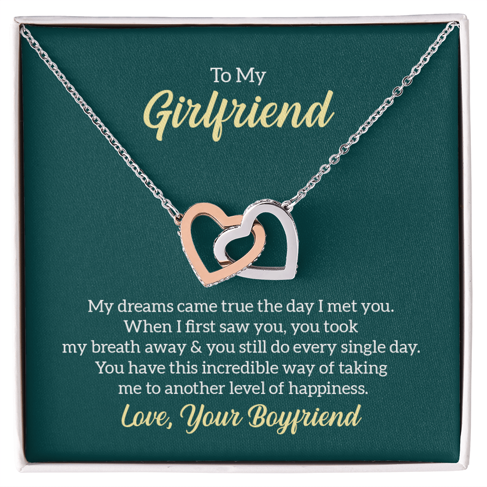 “Interlocking hearts necklace in silver and rose gold displayed in gift box with romantic ‘To My Girlfriend’ message card from boyfriend.”
