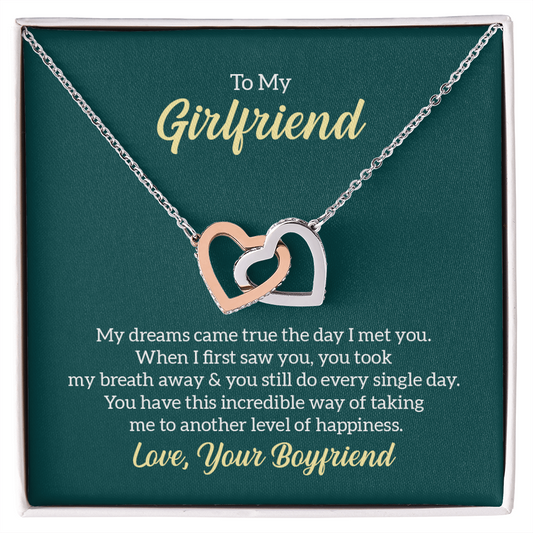“Interlocking hearts necklace in silver and rose gold displayed in gift box with romantic ‘To My Girlfriend’ message card from boyfriend.”