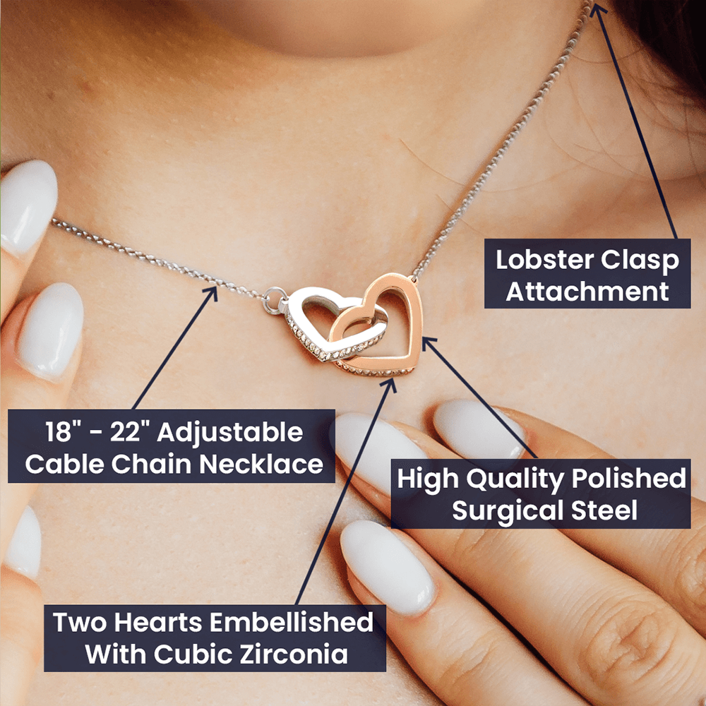 “Interlocking hearts necklace in silver and rose gold displayed in gift box with romantic ‘To My Girlfriend’ message card from boyfriend.”