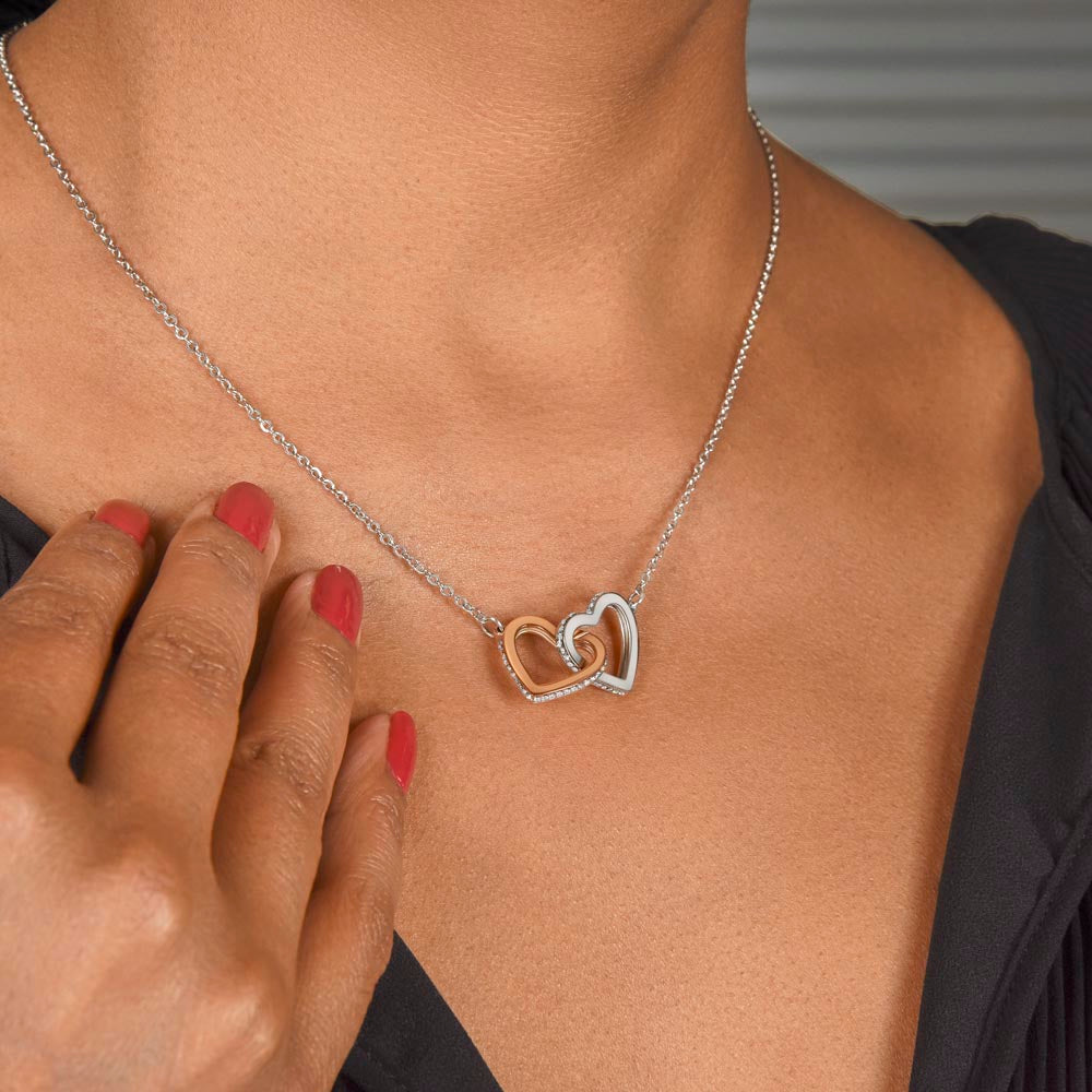“Interlocking hearts necklace in silver and rose gold displayed in gift box with romantic ‘To My Girlfriend’ message card from boyfriend.”