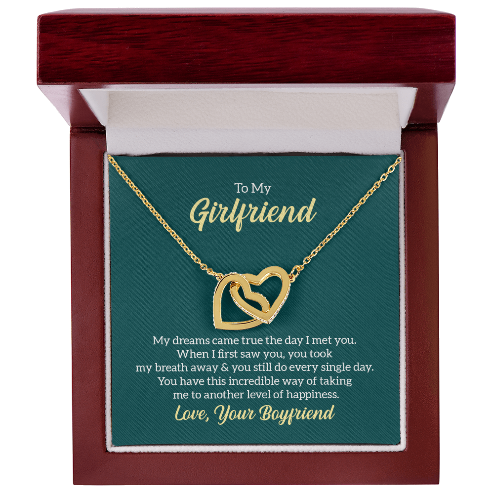 “Interlocking hearts necklace in silver and rose gold displayed in gift box with romantic ‘To My Girlfriend’ message card from boyfriend.”