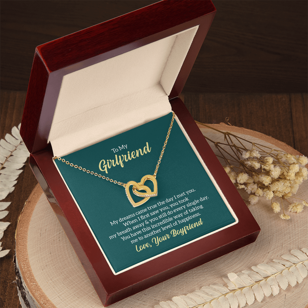 “Interlocking hearts necklace in silver and rose gold displayed in gift box with romantic ‘To My Girlfriend’ message card from boyfriend.”
