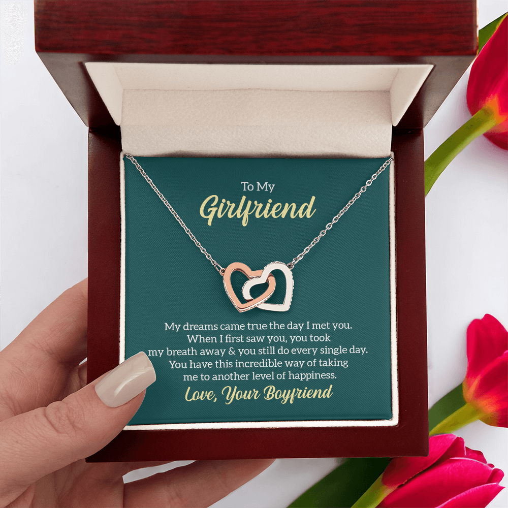 “Interlocking hearts necklace in silver and rose gold displayed in gift box with romantic ‘To My Girlfriend’ message card from boyfriend.”