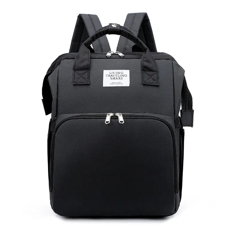 “Large‑capacity mommy backpack with front zipper pocket, dual top handles, and adjustable shoulder straps, designed for organized baby essentials and travel use.”