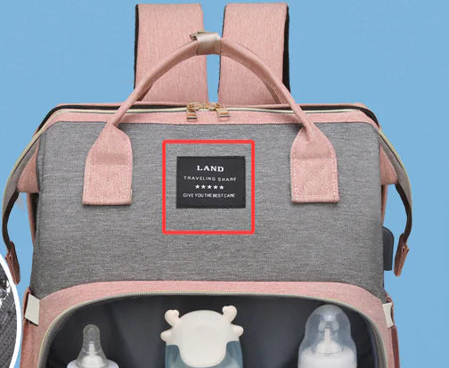 “Large‑capacity mommy backpack with front zipper pocket, dual top handles, and adjustable shoulder straps, designed for organized baby essentials and travel use.”