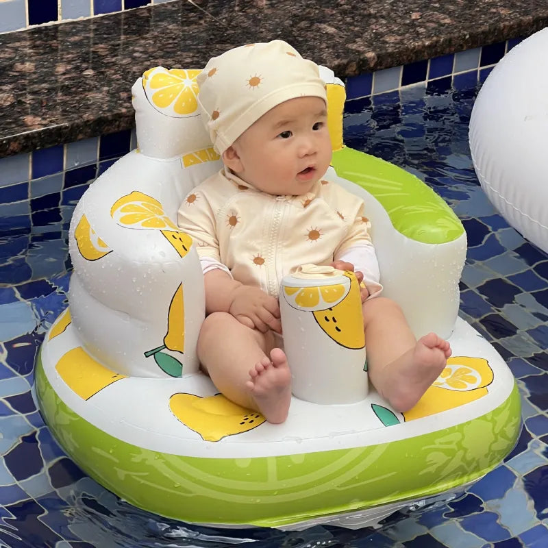 “Inflatable baby chair with supportive backrest and center post, featuring pink bunny pattern, designed for safe seating during dining or bath time.”