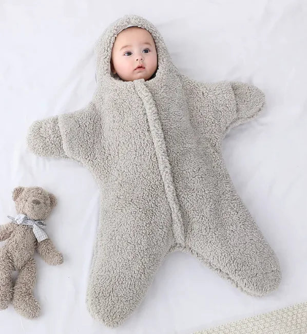 “Soft star‑shaped baby quilt with hooded, cozy fleece design, gentle on baby’s skin and perfect for nursery or crib use.”