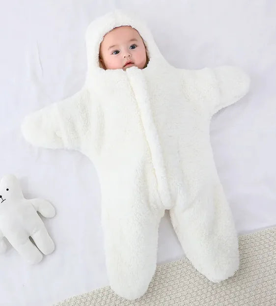 “Soft star‑shaped baby quilt with hooded, cozy fleece design, gentle on baby’s skin and perfect for nursery or crib use.”